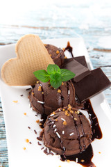 Ice cream scoops on wooden table