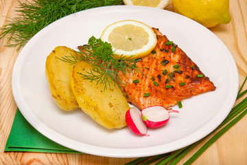 Grilled salmon fillet with boiled potatoes.  