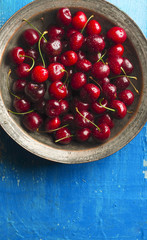 Fresh ripe cherries on a rustic background