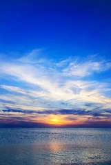 Crédence de cuisine en verre imprimé Mer / coucher de soleil Coucher de soleil jaune-bleu lumineux sous la mer