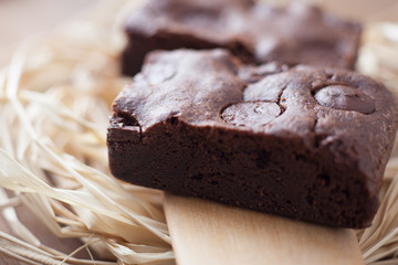 photo of two chocolate brownies stacked with selective focus
