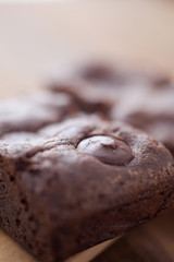 photo of two chocolate brownies stacked with selective focus