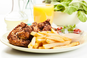 Chicken wings with fries french and spicy sauce