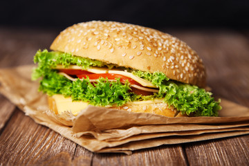 Delicious hamburger on a wooden table