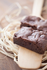chocolate brownies dessert on wood oar