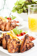 Chicken wings with fries french and spicy sauce