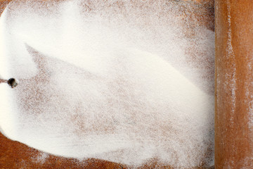 white flour on wooden table