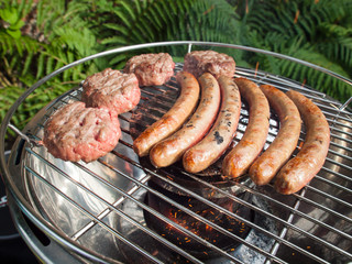 barbecueing sausages and beefburgers