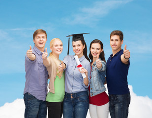 group of students with diploma showing thumbs up