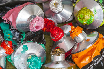 Tubes of acrylic color crushed and consumed