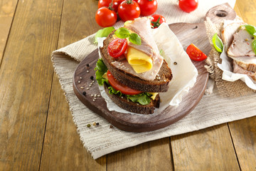Delicious sandwiches with meet on table close-up