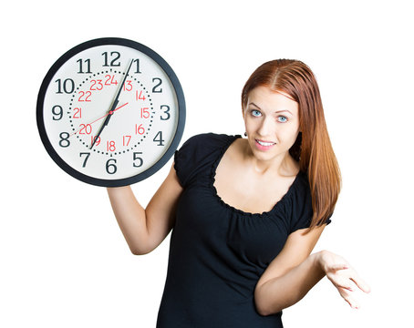 Business woman holding wall clock time is money concept 