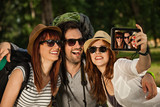 Three Tourists Taking Selfie