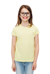 smiling cute little girl in black eyeglasses