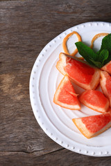 Ripe chopped grapefruit with mint leaves