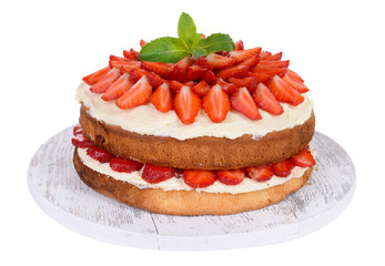 Delicious biscuit cake with strawberries isolated on white