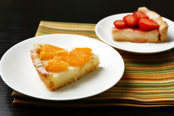 Piece of homemade orange and strawberry tarts