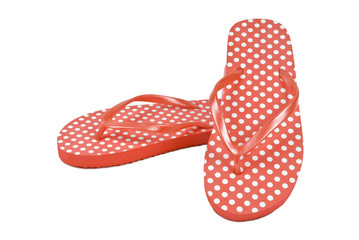 Spotted flip flops or thongs on white. Clipping path included.