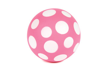 Pink spotted ball isolated on white. Clipping path included.