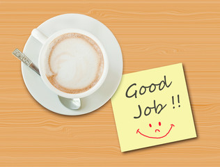 Coffee cup on wood table with paper note