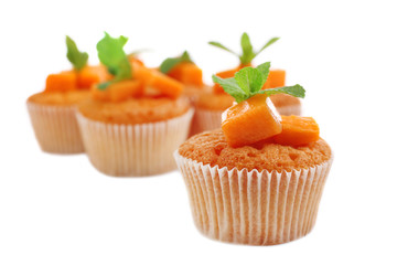 Tasty pumpkin muffins, isolated on white