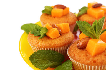 Tasty pumpkin muffins, isolated on white