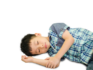 Happy Asian boy sleeping on green grass outdoors