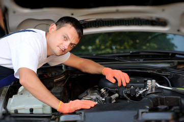 Fototapeta na wymiar Car mechanic in auto repair service