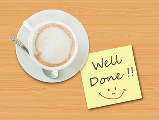 Coffee cup on wood table with paper note