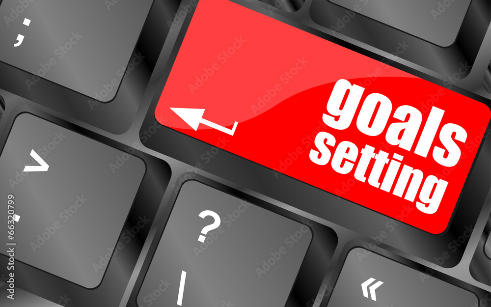 Poster goals setting button on keyboard with soft focus