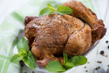 Close-up of a whole smoked chicken, horizontal shot