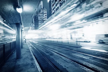 Fototapeten traffic with blur light through city at night © snvv