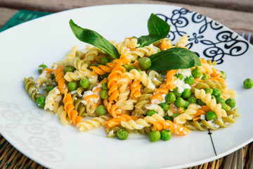 Italian pasta with ricotta cheese,olive oil, and fresh green pea
