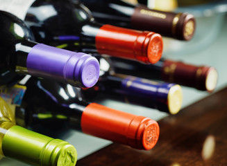 Bottles of wine in a winery. Red and white wine