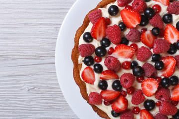 pie with fresh strawberries, raspberries and currants close-up
