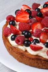 Delicious pie with fresh berries close up vertical