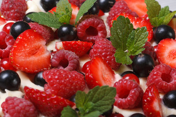 Background from strawberries, raspberries, currants and mint