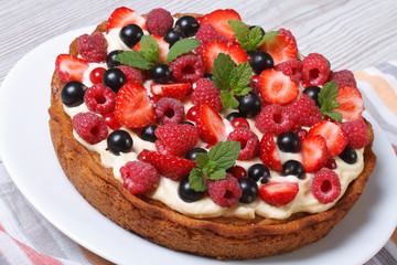 berry pie with fresh strawberries, raspberries, currants, mint