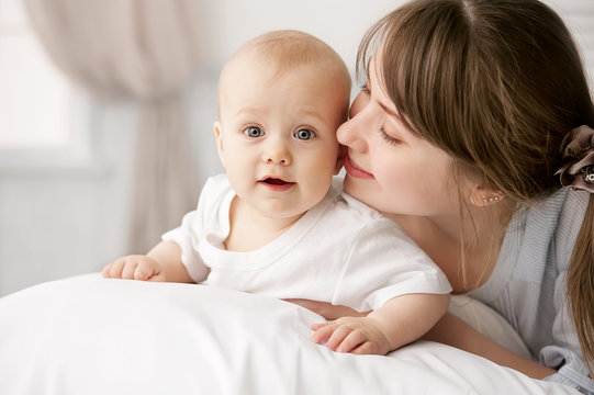 Portrait of happy mother and baby