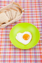 Scrambled in a heart shape on a plate.