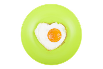 Scrambled in a heart shape on a plate.