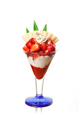 A delicious strawberry dessert with whipped cream and muesli