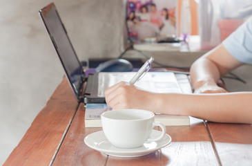 Woman working in coffee shop