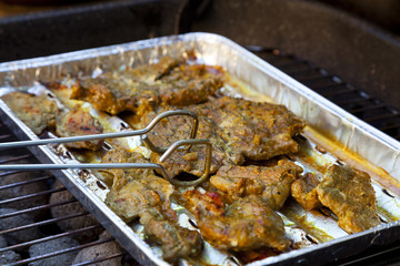 Grilled pork on a tray in the garden