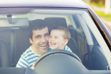 Father and son driving car