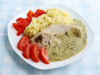 dinner meal with meat,diil sauce and vegetables