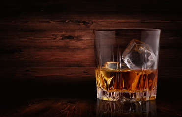 Glasses of whiskey with ice cubes