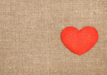 Felt red heart on the burlap