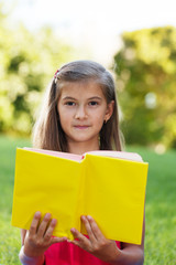 Fototapeta premium Little genius with yellow book