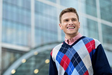 Handsome smiling man posing outdoor